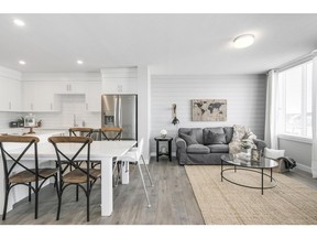 A look at the open concept great room and kitchen in one of the townhomes at Arrive at the Landing.