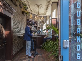 El Pequeño bar bar owner Kevin Demers (left) in his new Old Montreal bar, which has a capacity of 11 — including two bartenders.