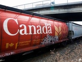 A train hauling grain passes through Calgary.
