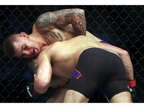 DALLAS, TX - MAY 13:  (L-R) Dustin Poirier fights against Eddie Alvarez in their Lightweight bout during UFC 211 at American Airlines Center on May 13, 2017 in Dallas, Texas.