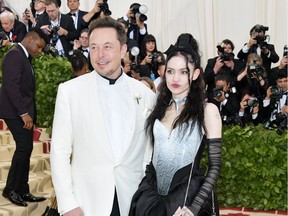 Elon Musk and Grimes attend the Heavenly Bodies: Fashion & The Catholic Imagination Costume Institute Gala at The Metropolitan Museum of Art on May 7, 2018 in New York City.