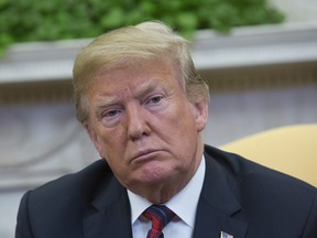 U.S. President Donald Trump listens during a meeting with Joshua Holt, members of Holt's family and the congressional delegation of Utah at the U.S. at The White House on May 26, 2018 in Washington, DC.