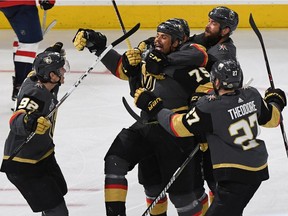 Tomas Nosek #92, Ryan Reaves #75, Pierre-Edouard Bellemare #41, Deryk Engelland #5 and Shea Theodore #27 of the Vegas Golden Knights celebrate after Reaves scored a third-period goal against the Washington Capitals during Game One of the 2018 NHL Stanley Cup Final at T-Mobile Arena on May 28, 2018 in Las Vegas, Nevada. The Golden Knights defeated the Capitals 6-4.