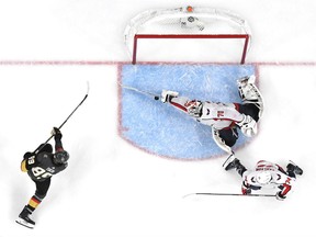 Braden Holtby of the Washington Capitals makes a diving stick-save on Alex Tuch of the Vegas Golden Knights during the third period of Game 2 of the Stanley Cup Final at T-Mobile Arena in Las Vegas on Wednesday night. The Capitals won 3-2 to tie the series.