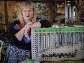 Good Life Community Bicycle Shop "greaser" Hope Madison Fay poses at the shop in Calgary, Alta., Friday, May 18, 2018. One day a week the shop serves only women and trans/non-binary people in an effort to make the bike community more inclusive.