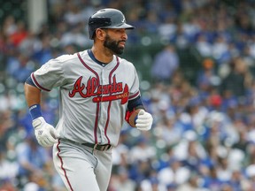 Atlanta Braves' Jose Bautista watches his three-run home run off Chicago Cubs' Jose Quintana during the fifth inning of a baseball game, Monday, May 14, 2018, in Chicago.