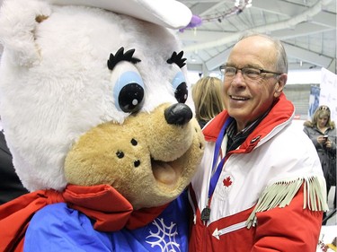 FEBRUARY 2013 - Frank King, Calgary Olympic organizing committee chair, takes part in an impromptu dance with Calgary Olympic mascot Hidy, during an event marking the 25 year anniversary of the 1988 winter Olympics at the Olympic Oval.
 (Stuart Gradon/Calgary Herald)