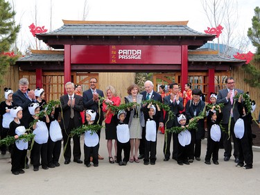 Dignitaries and officials cut the ribbon for the official opening of Panda Passage at the Calgary zoo on Monday May 7, 2018.