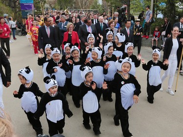 Kids dressed as giant pandas helped lead a parade during the official opening of Panda Passage at the Calgary Zoo on Monday May 7, 2018.