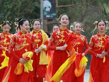 Dancers walk toward the official opening of Panda Passage at the Calgary Zoo on Monday May 7, 2018.