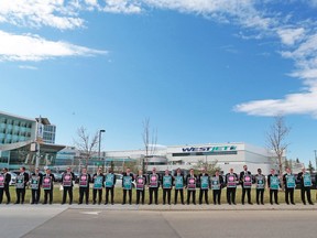 About 150 WestJet pilots protest outside the company's headquarters in Calgary during the WestJet annual general meeting on Tuesday May 8, 2018.