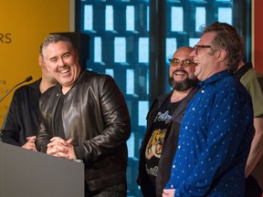 The Barenaked Ladies' Ed Robertson, left, has the band member laughing as he speaks during the band's induction into the Canadian Music Hall of Fame at Studio Bell on Wednesday, May 16, 2018. Gavin Young/Postmedia