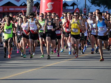 Runners race off  the start of the Jugo Juice 10 KM event during the Scotiabank Calgary Marathon Stampede Park on Sunday May 27, 2018.