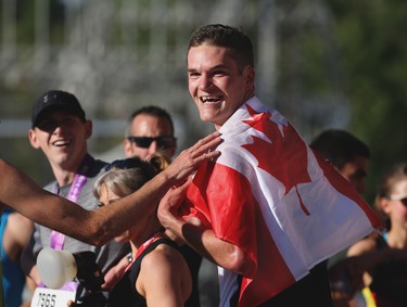 Calgary's Trevor Hofbauer was all smiles after winning the Centaur Subaru Half Marathon event at the Scotiabank Calgary Marathon at Stampede Park on Sunday May 27, 2018.