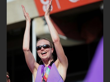 Kim Pumphrey cheers on other racers after she finished the Jugo Juice 10 KM event at the Calgary Marathon at Stampede Park on Sunday May 27, 2018.