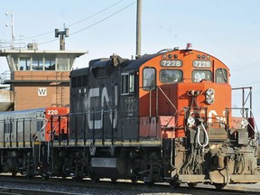 A CN locomotive makes it's way through the CN Taschereau yard in Montreal, Saturday, Nov., 28, 2009.