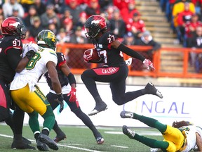 Stamps Tunde Adeleke (27) gets some air time during a return during the CFL Western Final in Calgary between the Calgary Stampeders and the Edmonton Eskimos on Sunday, November 19, 2017. Jim Wells/Postmedia