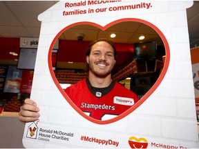 Calgary Stampeders linebacker Alex Singleton poses at the McDonald's on 4 St NW for McHappy Day in Calgary Wednesday, May 2, 2018. Every year, McDonald's Canada franchisees and crew across the country celebrate McHappy Day, an annual day of community giving in support of Ronald McDonald Houses and other local children's charities. On Wednesday May 2 for every Big Mac, Happy Meal or hot McCafé beverage purchased, $1 will be donated to RMHC and children's charities across Canada. Jim Wells/Postmedia