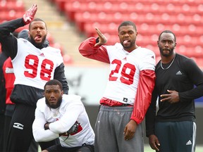 Calgary Stampeders players have a fun posedown and play for the camera during practice at McMahon Stadium in Calgary on Wednesday, May 30, 2018.  Jim Wells/Postmedia