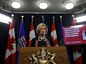 Alberta Premier Rachel Notley unveils an ad they will be running in B.C. about the pipeline expansion in Edmonton, Alta., on Thursday, May 10, 2018.