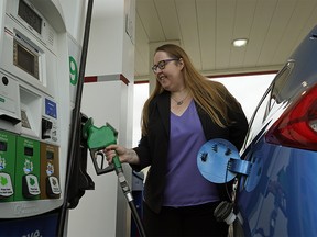 Alberta Labour Minister Christina Gray fills her car up with gas at the Brookview Husky gas station in Edmonton on Thursday May 31, 2018, where she provided an update on new Occupational Health and Safety rules in Alberta that come into effect June 1, 2018 to protect workers at gas stations and convenience stores. Gas station owner Ki Yun Jo was killed in Thorsby, Alberta on October 6, 2017 in a gas-and-dash incident when he tried to stop a gas thief. (PHOTO BY LARRY WONG/POSTMEDIA)