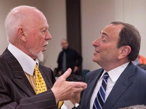 NHL CommissionerGary Bettman (right) chats with former Hockey Night in Canada host Don Cherry before discussing the launch of the upcoming season at a meeting of The Canadian Club of Toronto in Toronto on Monday September 22, 2014. Don Cherry put NHL commissioner Gary Bettman on the spot about expanding the league back into Quebec City. THE CANADIAN PRESS/Chris Young ORG XMIT: CPT141