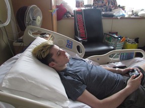 Former Humboldt Broncos player Ryan Straschnitzki takes a break after rehab at Foothills Hospital in Calgary in this photo taken Thursday, May 18, 2018. He was paralayzed from the chest down following an April bus crash in Saskatchewan.