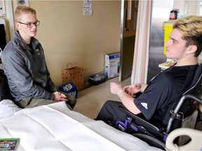 Humboldt Broncos hockey player Graysen Cameron (left) chats with his teammate 
Ryan Straschnitzki at Foothills Medical Centre in Calgary, on Tuesday May 29, 2018.