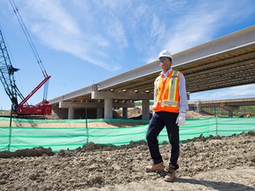 Rizwan Hussain, Urban Construction Manager with the Alberta Transportation's  Calgary Ring Road Group, stands underneath the new ring road bridges crossing the Elbow River west of the Weaselhead area on Monday May 28, 2018.