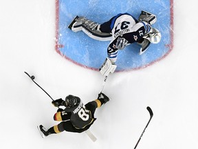 Jonathan Marchessault of the Vegas Golden Knights scores a first-period goal against Connor Hellebuyck of the Winnipeg Jets during Game Three of the Western Conference Finals on May 16, 2018.