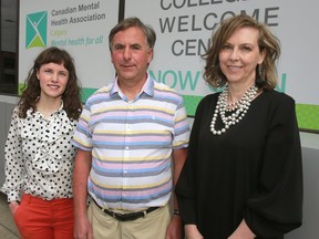Peer Support Workers Jess Smith (l) and Geoff Chiddell pose for a photo with CMHA Calgary Executive Director Laureen MacNeil (r) at the new Recovery College and Wellness Centre that opened at #105, 1040 7 Avenue S.W. Monday, May 7, 2018. Dean Pilling/Postmedia