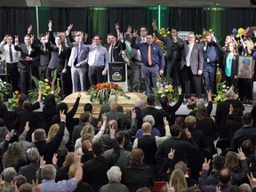 Students and teachers from Winston Churchill High School sing during the funeral service for Humboldt Broncos' Logan Boulet at the Nicholas Sheran Arena in Lethbridge, Alta. on Saturday, April 14, 2018. Nearly 100,000 Canadians signed up to become organ donors after learning a victim of last month's Humboldt Broncos bus crash had signed a donor card just weeks before the crash â€" and wound up saving six lives.