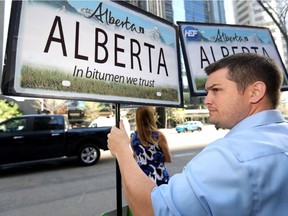 Nearly 100 pipeline supporters gather outside the conference centre hosting the Kinder Morgan annual general meeting in downtown Calgary on Wednesday, May 16, 2018.