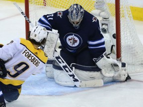 Filip Forsberg of the Nashville Predators beats Winnipeg Jets goaltender Connor Hellebuyck for one of his two goals in Monday's 4-0 Predators' victory in Game 6 of their Western Conference semifinal in Winnipeg. The victory ties the series at 3-3 heading back to Nashville for a decisive Game 7 on Thursday.