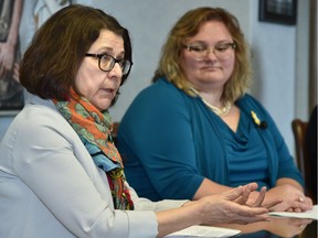 Celia Posyniak, left, executive director of Calgary's Kensington Clinic, and Health Minister Sarah Hoffman discuss the need for patients and health-care workers to be free from interference at locations where abortions are performed.