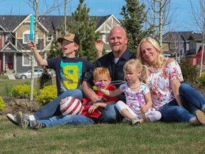 Alisa and Ray Piraux with their children Maddox, Quinton, and Emerson in the Cochrane community of Fireside by La Vita Land.