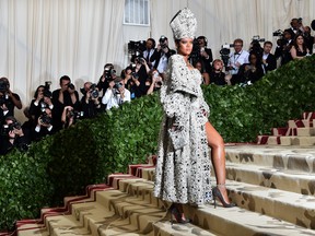 Queen/Pope Rihanna arrives for the 2018 Met Gala at the Metropolitan Museum of Art in New York, turning heads and changing lives.