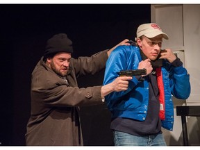 Jerod Blake bringing in the gangster played by Samuel G. Hoeksema in Rogues Theatre's A Beautiful New City.