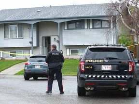 Calgary police attend a scene where a man was shot on Penbrooke Close S.E. in Calgary on Thursday, May 17, 2018.