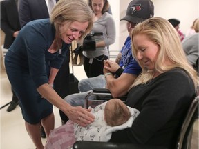 Premier Rachel Notley meets baby Khali High and her mom Victoria during the grand opening of the newly redeveloped maternity care unit at the Peter Lougheed Centre in Calgary on Friday May 11, 2018.