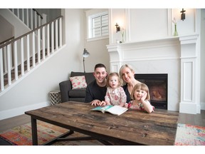 Nick and Lynn Szczepaniak with their two daughters Prim and Layla in their home at Five Lakes at Rock Lake Estates.