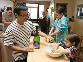 Yukichi Hattori with Mae and Luka (and mom, Galien Johnston-Hattori lurking in the background) helping to prepare the contents of the Gyoza.