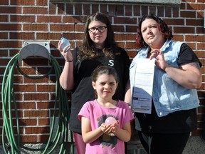 Genevieve Lamy, right, with her daughter's Félycia, top left, and Delphine, who were given a fine for using water to fill up balloons in a Quebec town. Courtesy Genevieve Lamy