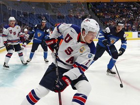 BUFFALO, NY - DECEMBER 31: Brady Tkachuk #7 of United States skates with the puck as Eeli Tolvanen #20 of Finland pursues in the first period during the IIHF World Junior Championship at KeyBank Center on December 31, 2017 in Buffalo, New York. (Photo by Kevin Hoffman/Getty Images) ORG XMIT: POS2018010119513213