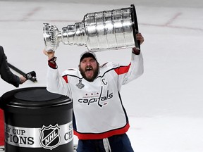Washington Capitals captain Alex Ovechkin lifts the Stanley Cup after his team defeated the Vegas Golden Knights 4-3 in Game 5 of the 2018 Stanley Cup final on June 7, 2018 at T-Mobile Arena in Las Vegas.