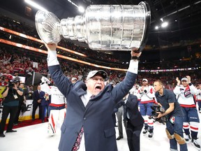 In this June 7 file photo, Washington Capitals head coach Barry Trotz hoists the Stanley Cup in Las Vegas.