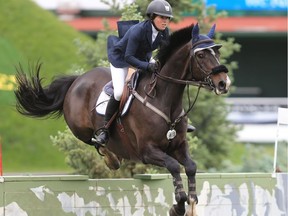 Canada's Ali Ramsey riding Casino competes in the CNOOC Nexen Cup at the Spruce Meadows National on Sunday June 10, 2018.  Gavin Young/Postmedia