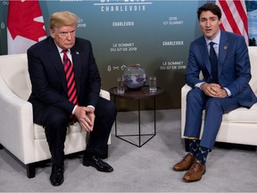 U.S. President Donald Trump and Canadian Prime Minister Justin Trudeau hold a meeting on the sidelines of the G7 Summit in La Malbaie, Quebec, on Friday, June 8, 2018.