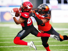 Calgary Stampeders Blake Jackson makes a catch in front of Tevin McDonald BC Lions during CFL pre-season football in Calgary on Friday, June 1, 2018. Al Charest/Postmedia
