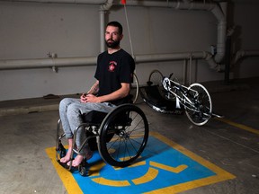 Dalten Campbell was photographed where he last saw his 2006 Dodge Magnum which was stolen from the underground parkade at his apartment with his custom wheel chair basketball chair inside. Behind Campbell is his racing wheel chair which was parked next to the car and was all that remained in the stall after the theft sometime overnight on Friday June 15. Gavin Young/Postmedia